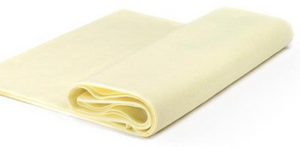 A side-view of a stack of felt in a rainbow of shades