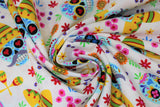 Swirled swatch Skull Sombrero White fabric (white fabric with tossed brightly coloured sugar skull heads, some in sombreros with tossed floral and maracas in various colours)