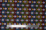 Flat swatch Sugar Skull Stripe fabric (black fabric with colourful swirly greenery look decor allover in lines of colour: pink, blue, purple, yellow, orange with brightly coloured sugar skulls inside)