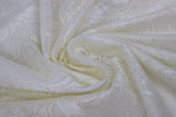 Swirled swatch Damask Drapery Lace in cream (loose mesh lace detail with floral/greenery like pattern)