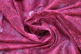 Swirled swatch burgundy Marble Drapery Lace (tight mesh with busy floral/stem like design allover)