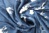Swirled swatch antlers fabric (dark blue fabric with white deer head and antler silhouettes and outlines in white)