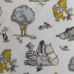 Square swatch Winnie the Pooh printed fabric (white fabric with drawn characters, trees, and floral tossed)
