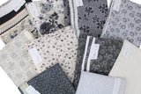 Twin Quilt DIY Kit contents: multi fabric swatches in white/grey/black floral (Blackwood Cottage) white/grey/black floral quilt