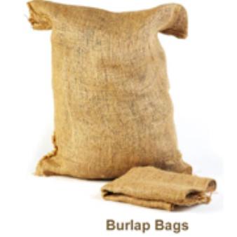 A filled burlap bag sits against a white background.  An empty, folded burlap bag lies in front of it, with the words 
