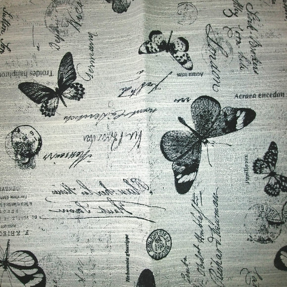 Black and White upholstery fabric featuring images of butterflies and scribbled notes reminiscent of a Victorian biologist's notebook