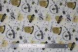 Flat swatch bee's life fabric (white fabric with tossed assorted honey bee emblems and text, hives, bees, honeycombs, "Honey" "Pure Raw Honey" etc. in black/white/yellow gold)