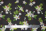 Flat swatch grove fabric (black fabric with medium sized white pointy floral heads with green leaves and stems tossed allover with tiny red and pink floral heads tossed)