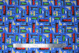 Flat swatch Blue fabric (medium blue fabric with scattered train related emblems: red, green and blue trains, clouds, houses, mountains, windmills, etc.)