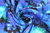 Swirled swatch galaxy fabric (black fabric with large blue, teal and purple galaxy shaped light forms with bright white stars)