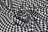Swirled swatch sporty checkered flag fabric (black and white checkered pattern allover with wave to pattern)