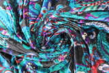 Swirled swatch Paisley fabric (black fabric with large tossed paisley print allover in blue, teal, purple shades)