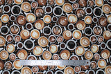 Flat swatch fresh brew fabric (top view of white mugs in various sizes holding many styles of coffee/lattes with brown coffee beans in between spaces, printed allover)