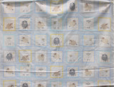 Full panel swatch - Sweet Dreams Square Panel (44" x 24") (pale blue rectangle with tiled squares within with sleepy sheep graphics and blue, brown, yellow borders/frames)