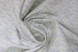 Swirled swatch dreamy leaf fabric (cream coloured fabric with subtle pale blue swoopy greenery style leaves allover)