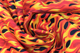 Swirled swatch firehouse fabric (black fabric with bright yellow, orange, red cartoon flames allover)