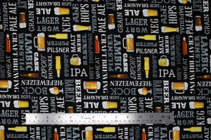 Square swatch Grab Me A Beer fabric (black fabric with horizontal and vertical text allover in white with beer related words "Ale" "IPA" "Hops" etc. and assorted beer glasses, steins and bottles)
