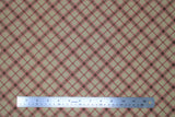 Flat swatch rustic plaid fabric (tan fabric with diagonal plaid stripe lines in brown and pink)