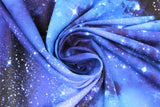 Swirled swatch night sky fabric (light to dark blue marbled look galaxy sky style fabric with many white star dots)