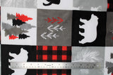 Flat swatch cabin quilt red fabric (quilt squares look fabric with cabin themed squares, moose, pinecones, bears, trees etc. in white, grey, black and red colourway)