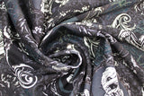Swirled swatch Scary Wicked Portraits fabric (charcoal fabric with mummy and skull framed portraits and spiderwebs, etc.)
