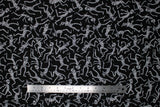 Flat swatch Dancing Mummies fabric (black fabric with tossed dancing white mummies allover)