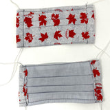 Front and back view of mask with white elastic ear loops (light grey mask with red maple leaves allover "Canada" and "eh?" text)