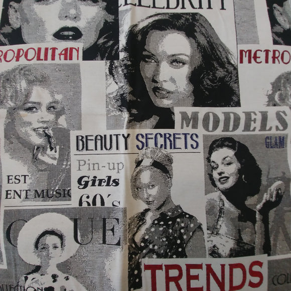 Woven upholstery fabric featuring stacked black and white magazine covers with red and navy accent text and titles such as Models and Beauty Secrets.  Magazine covers feature women resembling classic Hollywood leading ladies