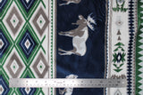 Flat swatch denali fabric (southwest style fabric with thick stripes of geometric/diamond like pattern, thick blue stripes with white and grey moose graphics, all in white, grey, green and blue colourway)