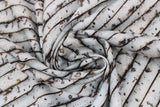 Swirled swatch nature themed fabric horizontal birch trees stipes