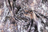 Swirled swatch nature themed fabric grey/brown rock face texture with white water