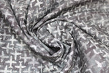 Swirled swatch journey themed fabric in airplane texture charcoal (dark grey/black marbled watercolour look fabric with light grey marbled airplane shapes tiled/criss crossing)