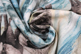 Swirled swatch dawn elephant fabric - long rectangular fabric with line of 5 grey elephants along bottom in shallow water surrounded by rock, above lines of cream and blue sky texture and birds