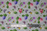 Flat swatch floral toss fabric (pale grey fabric with tossed pink, purple, white floral with green leaves and stems, and small tossed butterflies in yellow, pink, purple colours)