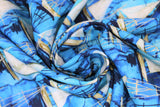 Swirled swatch small boats fabric (light to medium blue marbled water look fabric with small white sailboats allover)