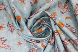 Swirled swatch blue owls fabric (light blue fabric with tossed drawn style white/grey barn owls in various poses/flight stages and tossed white and orange stars in various sizes, tossed orange crescent and full moons)