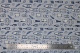 Flat swatch craft brew fabric (pale blue grey fabric with white/pale dark blue craft beer related emblems including beer bottles, steins, barrels, barley, pretzels, etc. allover)