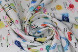 Swirled swatch goals fabric (white fabric with small painted look graphics in full colour of around the house items/goals sewing machine, books, etc. and text associated "sew" "more books" etc)