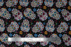 Group swatch assorted Folkloric Skulls themed fabrics in various styles/colours