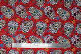 Flat swatch red fabric (red fabric with medium sized tossed sugar skull heads with colourful decorative floral and swirly designs allover in blue, orange, red, green, purple, etc. with tossed floral)