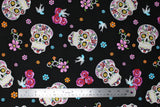 Flat swatch large fabric (black fabric with large loosely tossed sugar skull heads with colourful decorative floral and swirly designs within, tossed floral heads and birds)