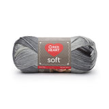 Ball of Red Heart soft yarn in greyscale (light to dark grey ombre)