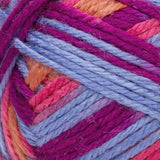 Red Heart soft yarn swatch in shade bohemian (light pink, orange, blue, and purple shades)
