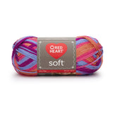 Ball of Red Heart soft yarn in bohemian (light pink, orange, blue, and purple shades)