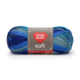Ball of Red Heart soft yarn in seaglass (light to dark blue ombre)