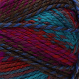 Swatch of Red Heart Gemstone yarn in red topaz (burgundy, wine, medium blue, dark brown colourway with twists)