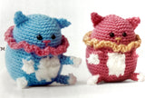 Completed Amigurumi cats (pink and blue with scarves)