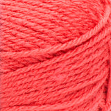 Swatch of Red Heart Heat Wave yarn in shade beach ball (coral)