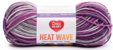 Ball of Red Heart Heat Wave yarn in shade ultra violet (light to dark purple ombre)
