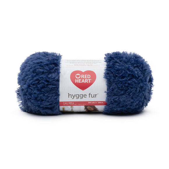 Ball of Red Heart Hygge Fur textured yarn in blue shade